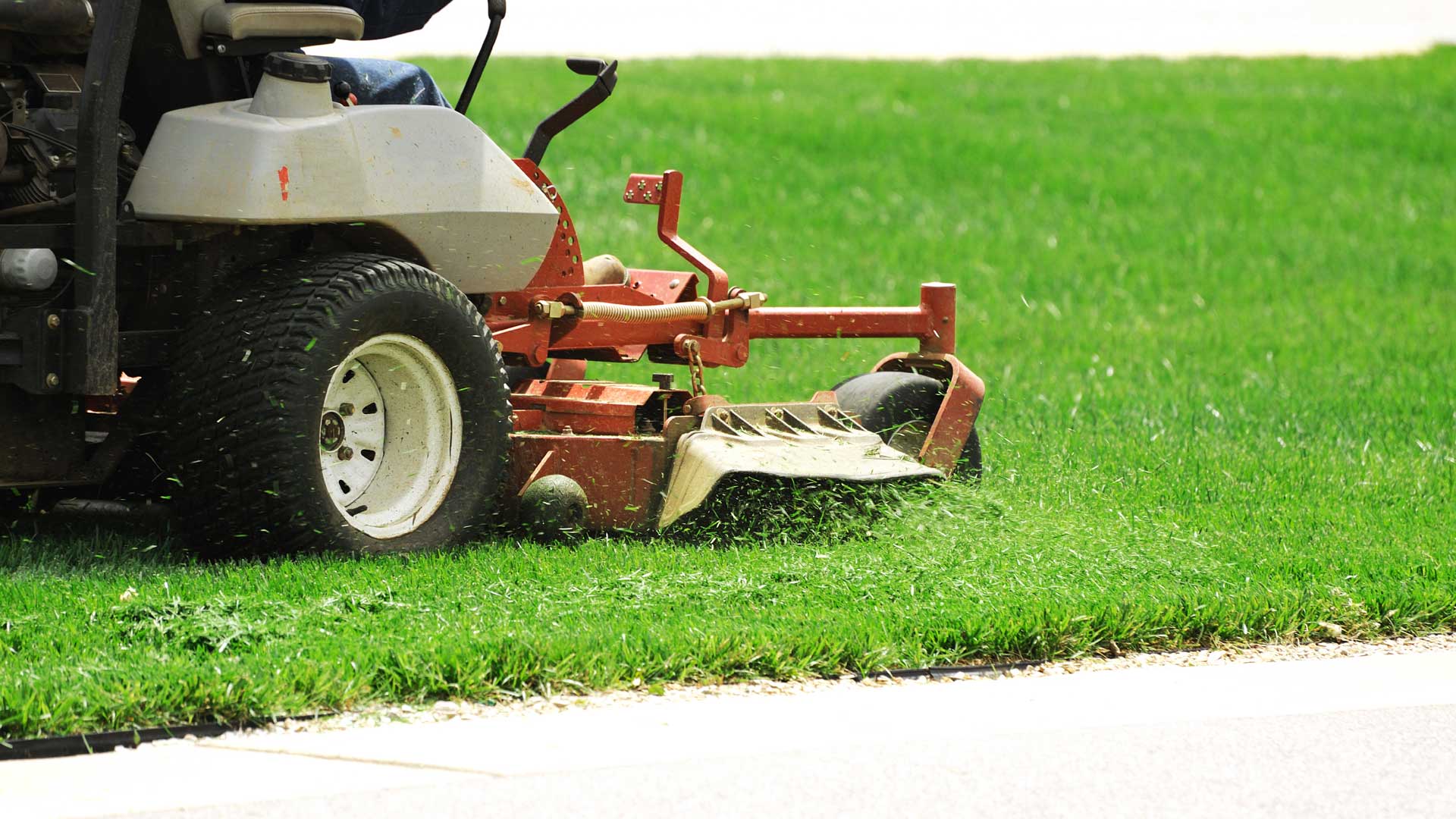 Upstate Turf Pros mowing a lawn at a home in Greenville, SC.